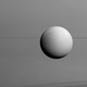 Dione against a backdrop of Saturn’s rings. Image: NASA/JPL-Caltech/Space Science Institute